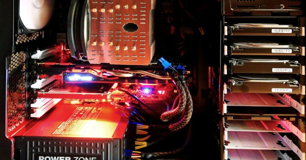 Close-up of a custom gaming PC with RGB lighting, showcasing power supply and components.
