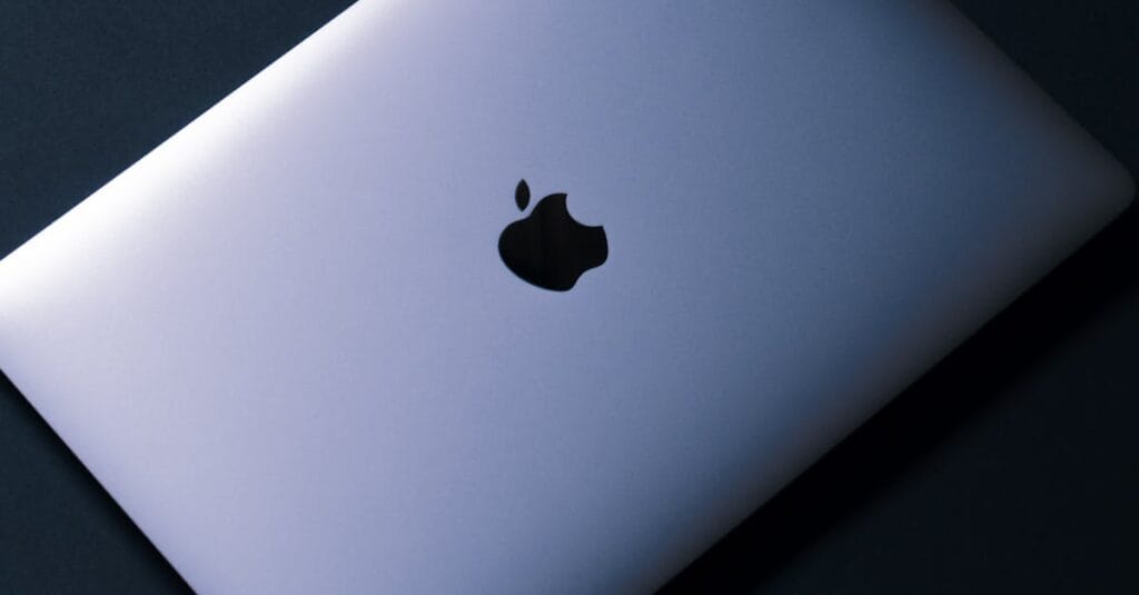 Sleek laptop placed against a black background, showcasing modern technology.