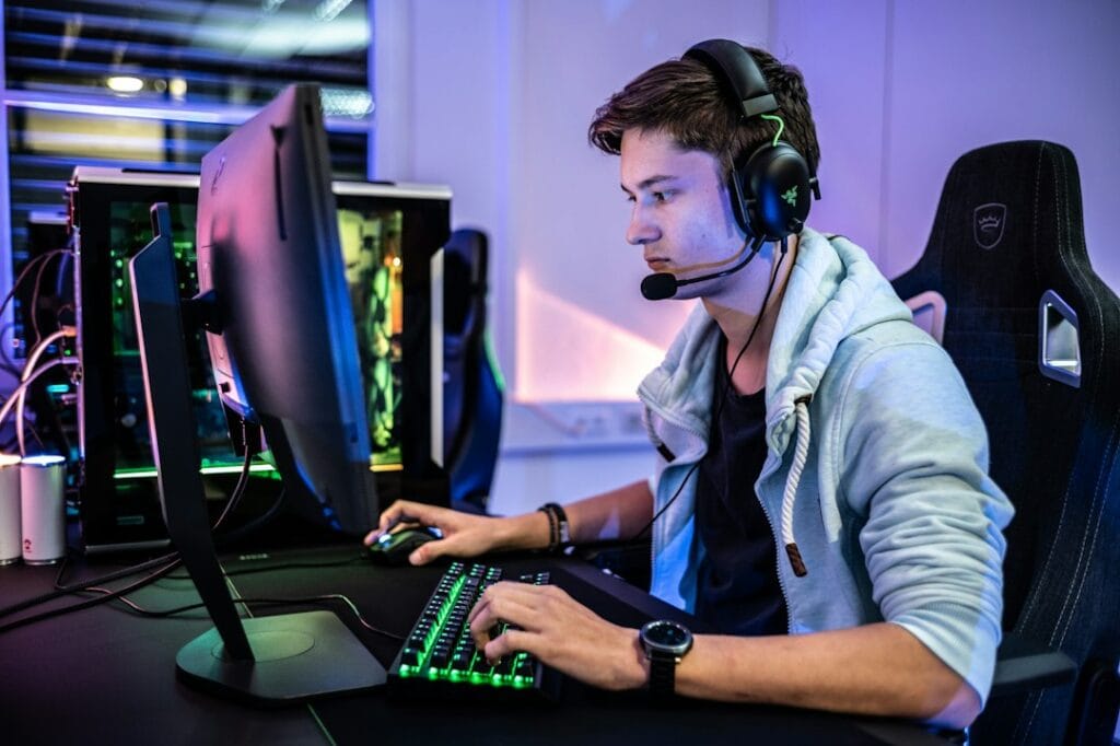 Gamer wearing a headset in front of a PC