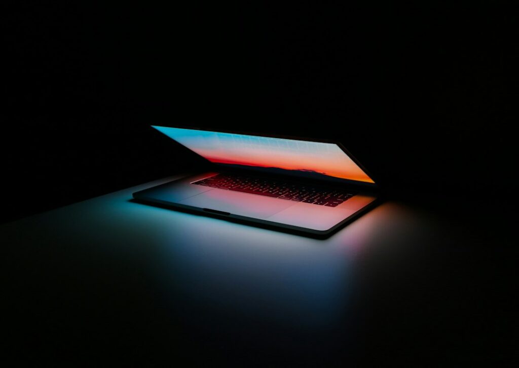 Gray and black laptop on a desk