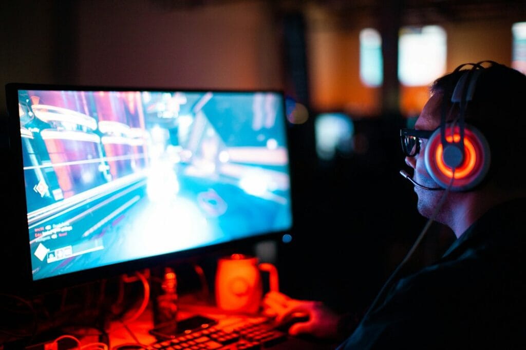 Person playing an FPS game on a PC