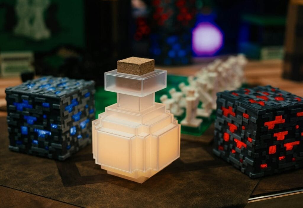 A glowing lamp between two pixelated ore blocks on a table