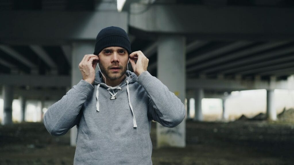 Runner putting in wireless earbuds