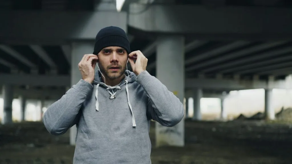 Runner putting in wireless earbuds
